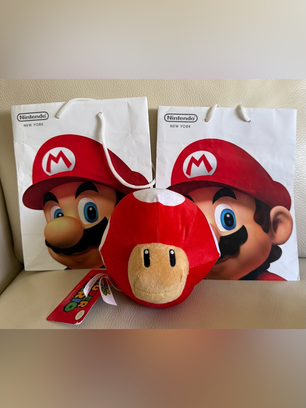 2 Nintendo Mario Paper Shopping  Bags - Rockafeller Center NYC & plush mushroom